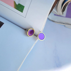 Earrings studded with purple enamel