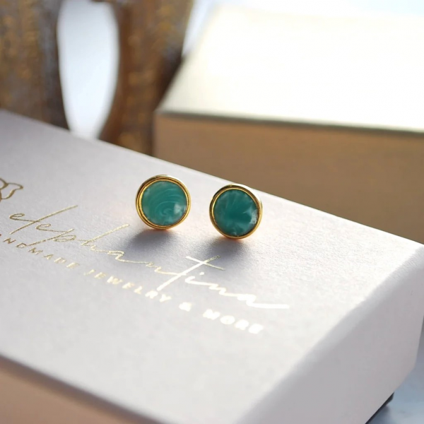 Earrings studded with green enamel