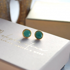 Earrings studded with green enamel